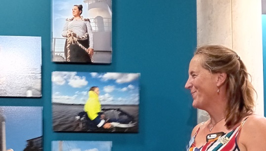 Nautilus Council member Captain Jessica Tyson with the pictures of herself and other Nautilus members at work in the She Sees exhibition Image:Nautilus Council member Captain Jessica Tyson with the pictures of herself and other Nautilus members at work in the She Sees exhibition