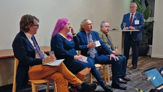 Image:Director of legal services Charles Boyle (left) spoke to legal professionals at the case law
symposium on the MLC delivered by the ILO’s International Training Centre. 
Nautilus International