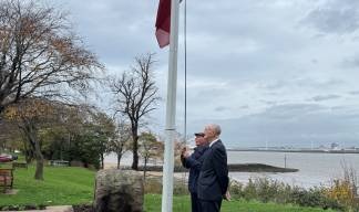 Image:Gary Dickinson and Alex Harrison raising and lowering the flag during the outdoor service.