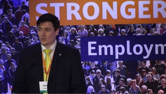 Image:Director of organising Martyn Gray speaking at the 2025 Nautilus UK Branch Conference. Image: Nautilus International