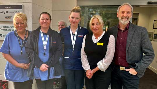 Retiring Nautilus Welfare Fund manager Mick Howarth, right, with some of the staff at Mariners' Park outside the Trinity House Hub. Image: Nautilus Welfare Fund Image:Retiring Nautilus Welfare Fund manager Mick Howarth, right, with some of the staff at Mariners' Park outside the Trinity House Hub. Image: Nautilus Welfare Fund