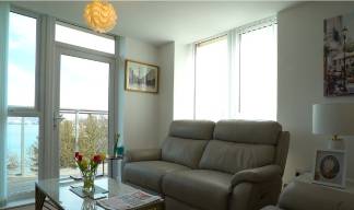A Nautilus House apartment living room with balcony views across the River Mersey. Image: Nautilus International Image:A Nautilus House apartment living room with balcony views across the River Mersey. Image: Nautilus International